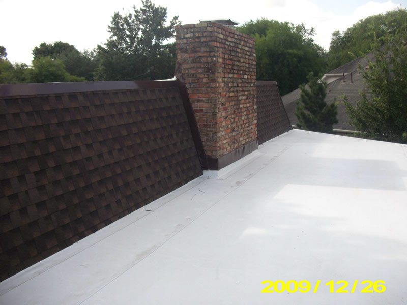 A roof with brick and metal covering on it